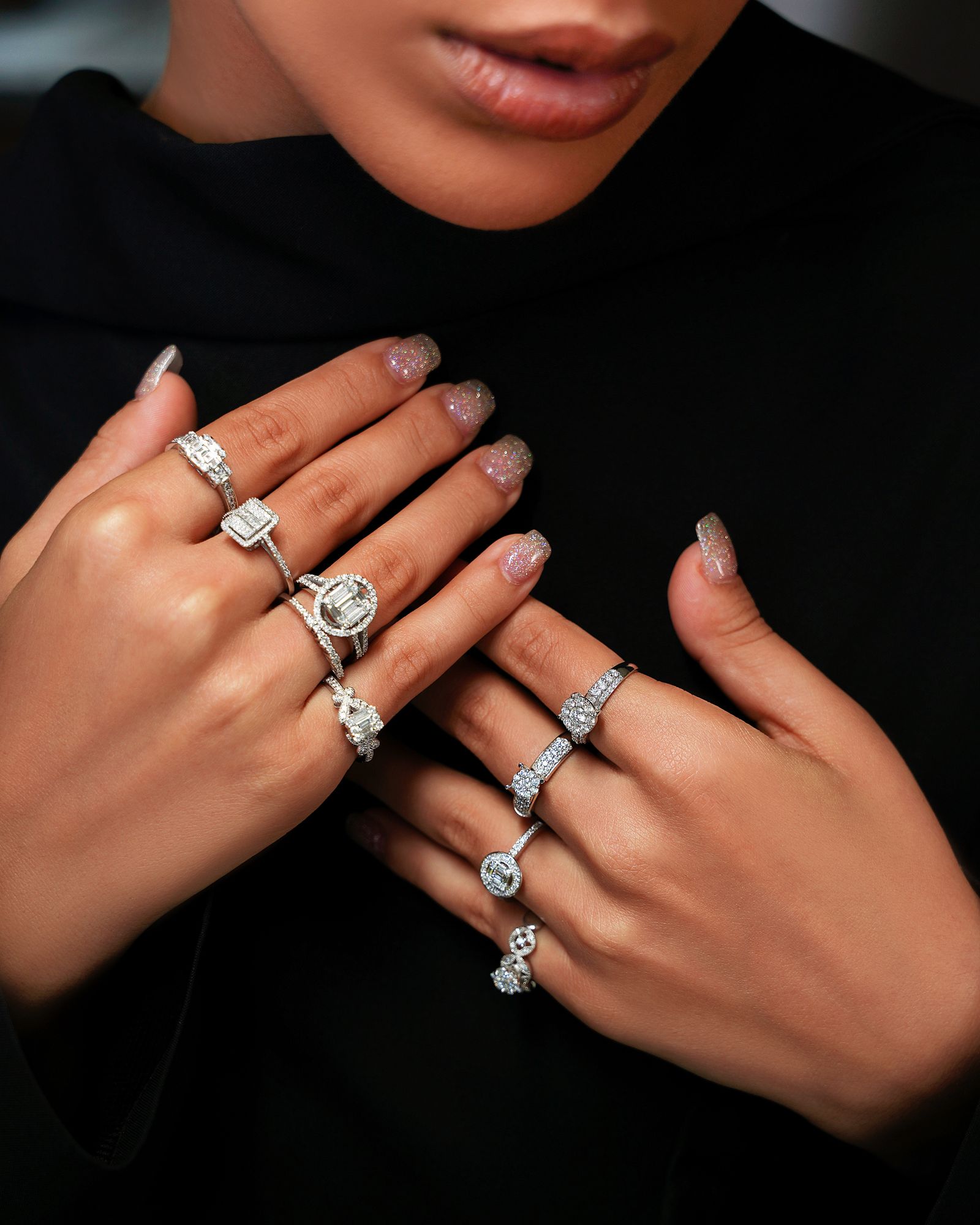 Elegant woman's hands adorned with diamond rings