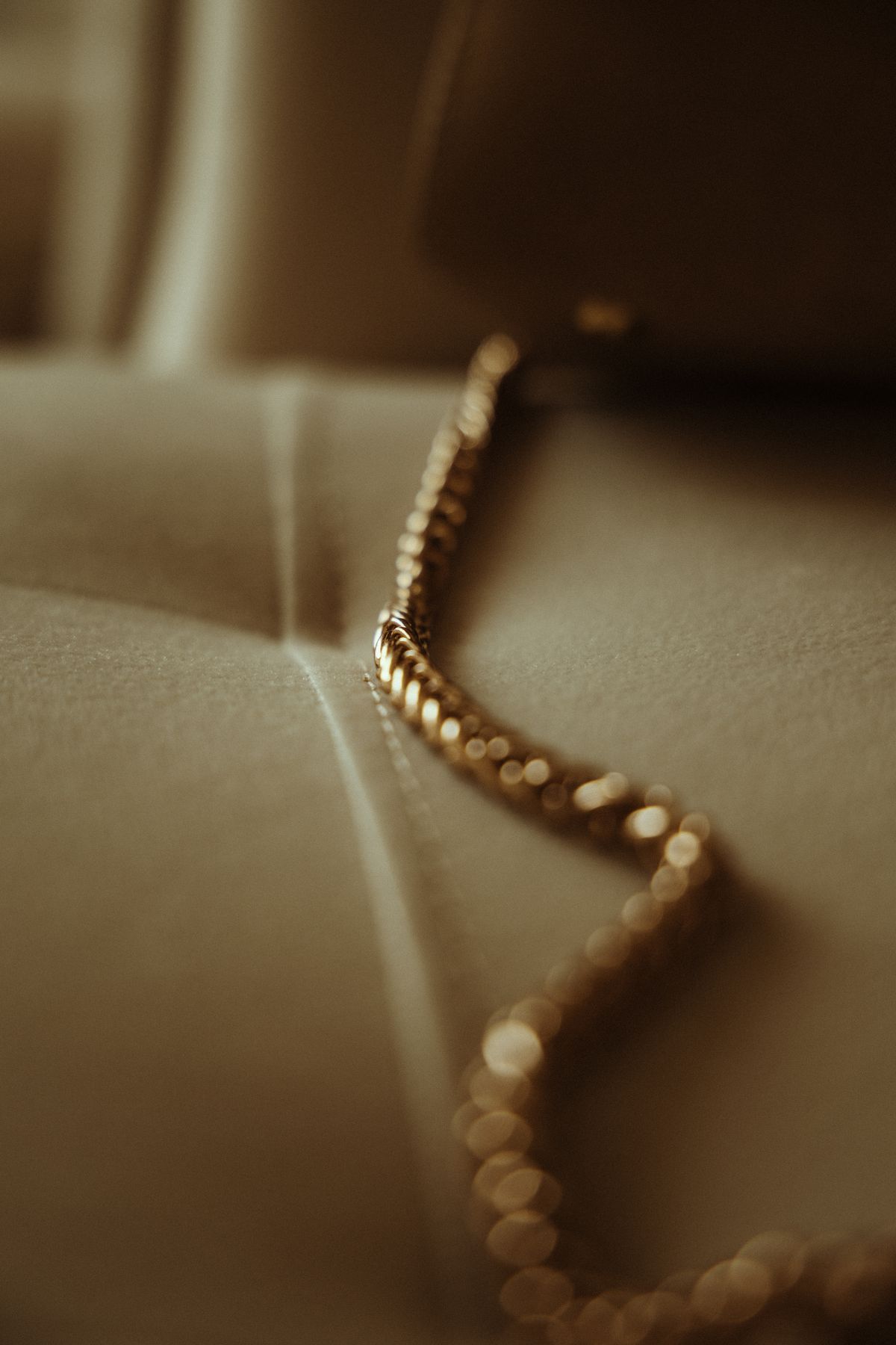 Close-up of a plain gold chain necklace