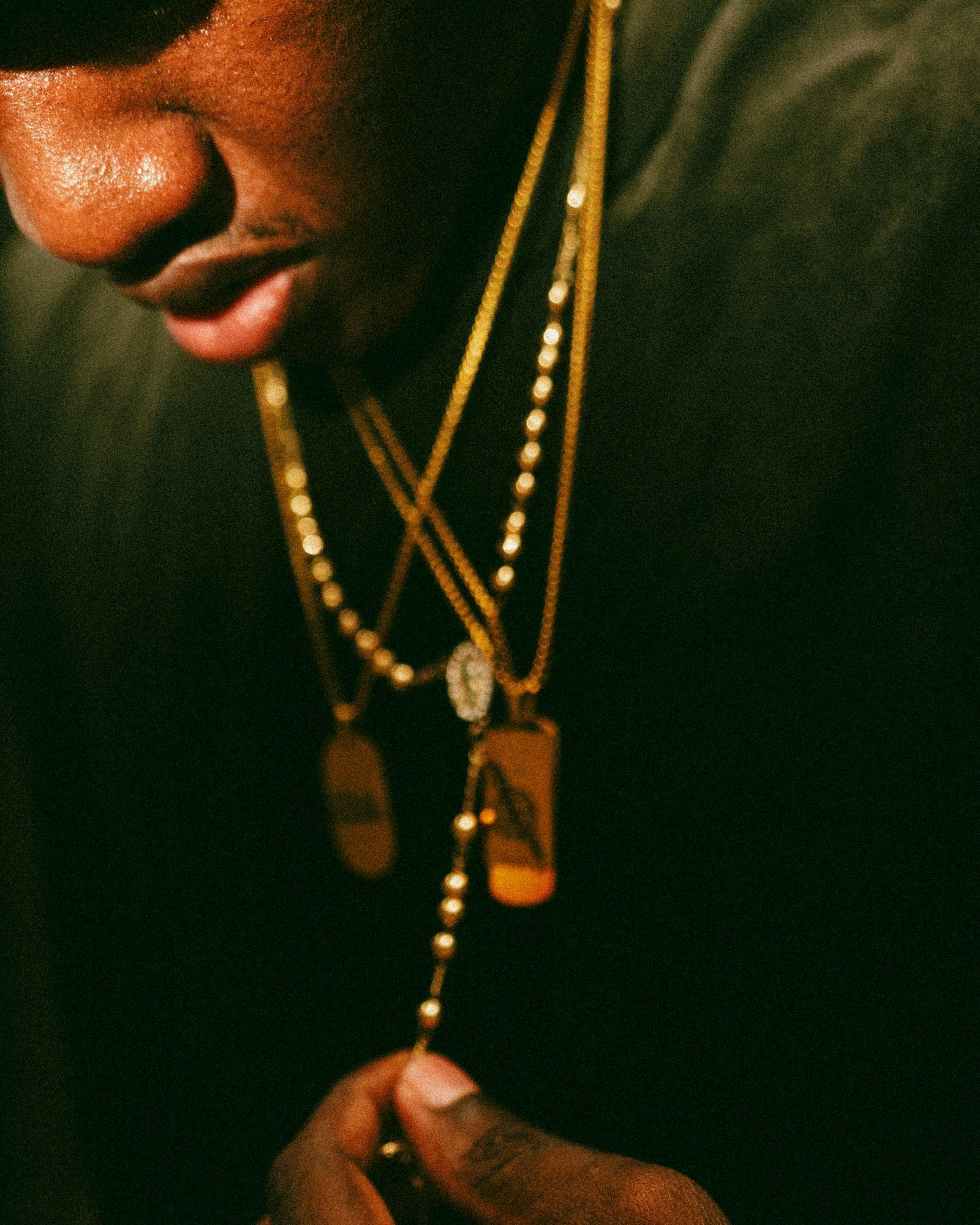 Close-up of gold chain in warm light