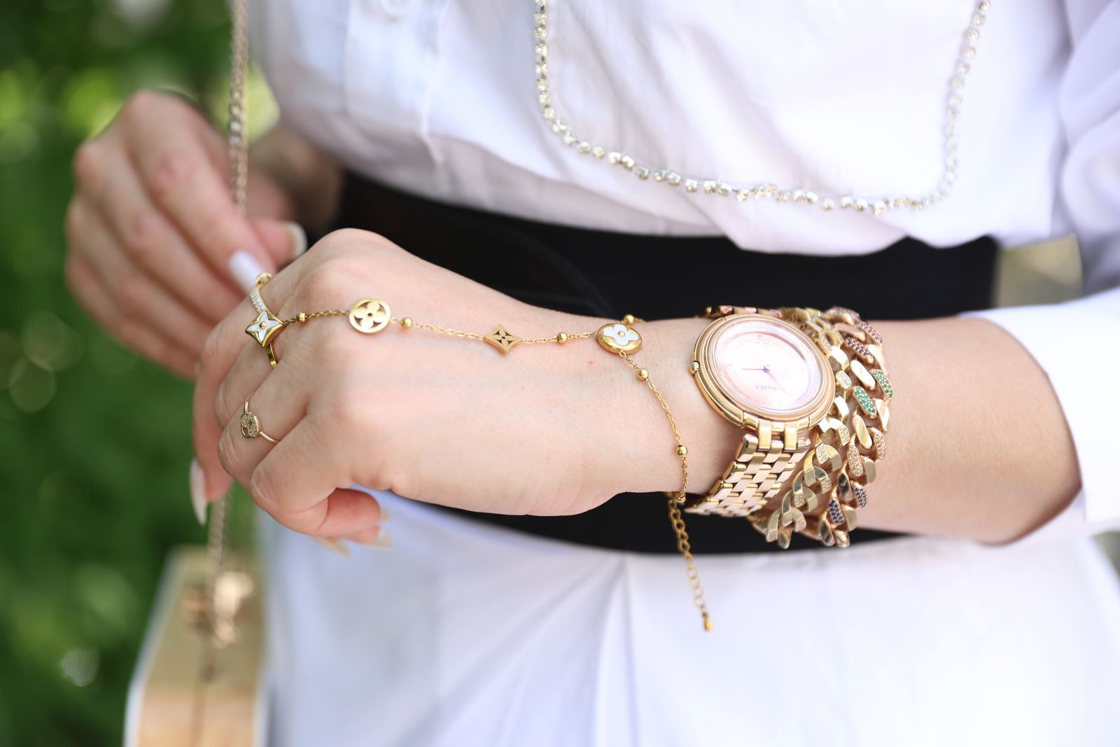 Gold jewelry on a woman's hand